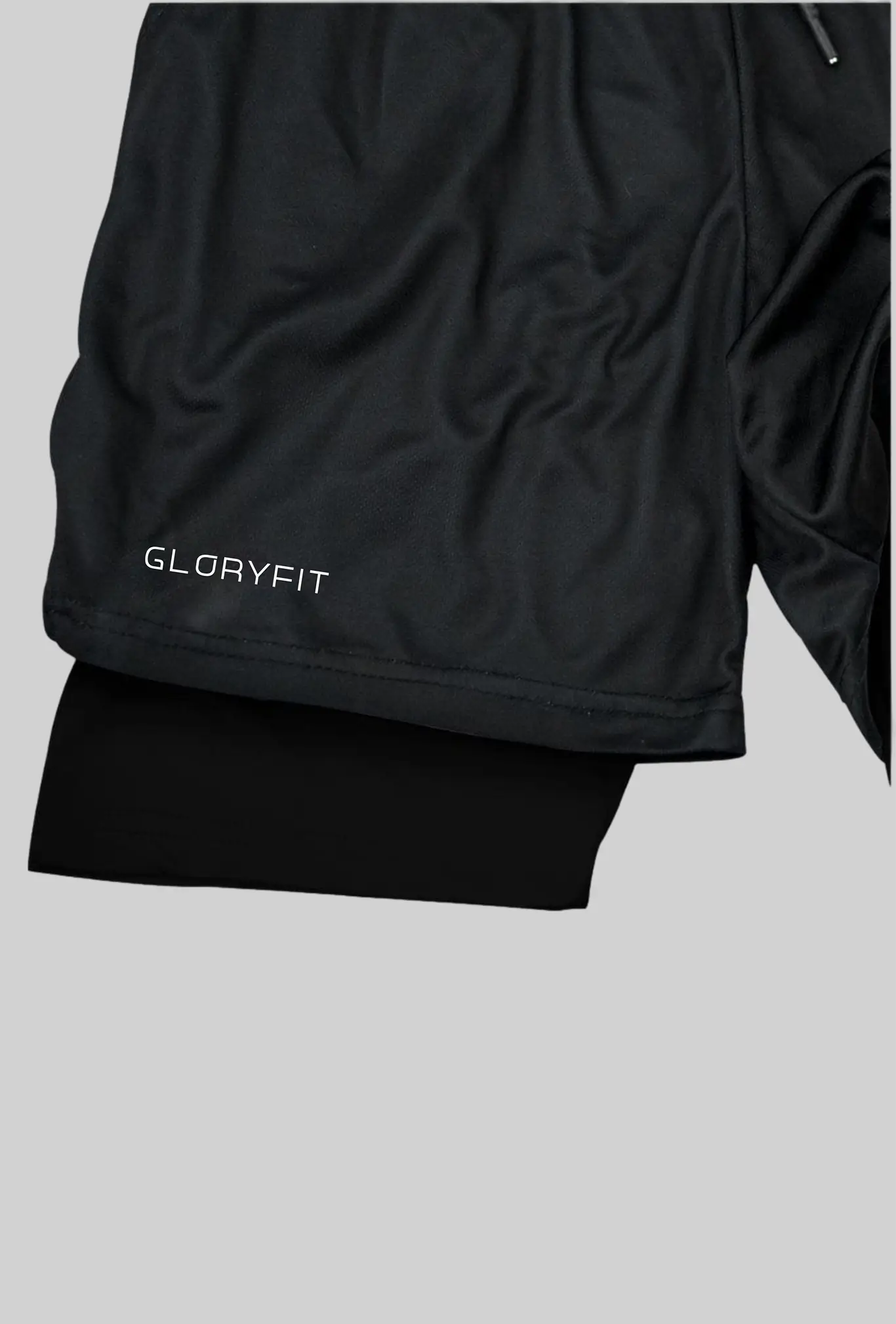 Shorts 2 em 1 GLORYFIT Orthodox mostrando detalhe do tecido e acabamento